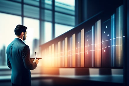 man-front-computer-screen-with-graph-it