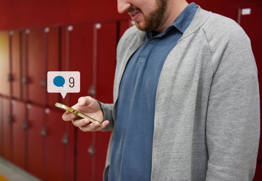 student-using-social-media-his-smartphone