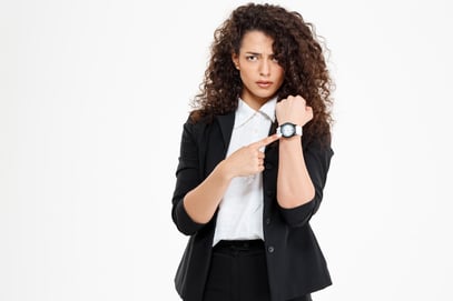 young-tender-curly-girl-looking-watch-worried-that-late