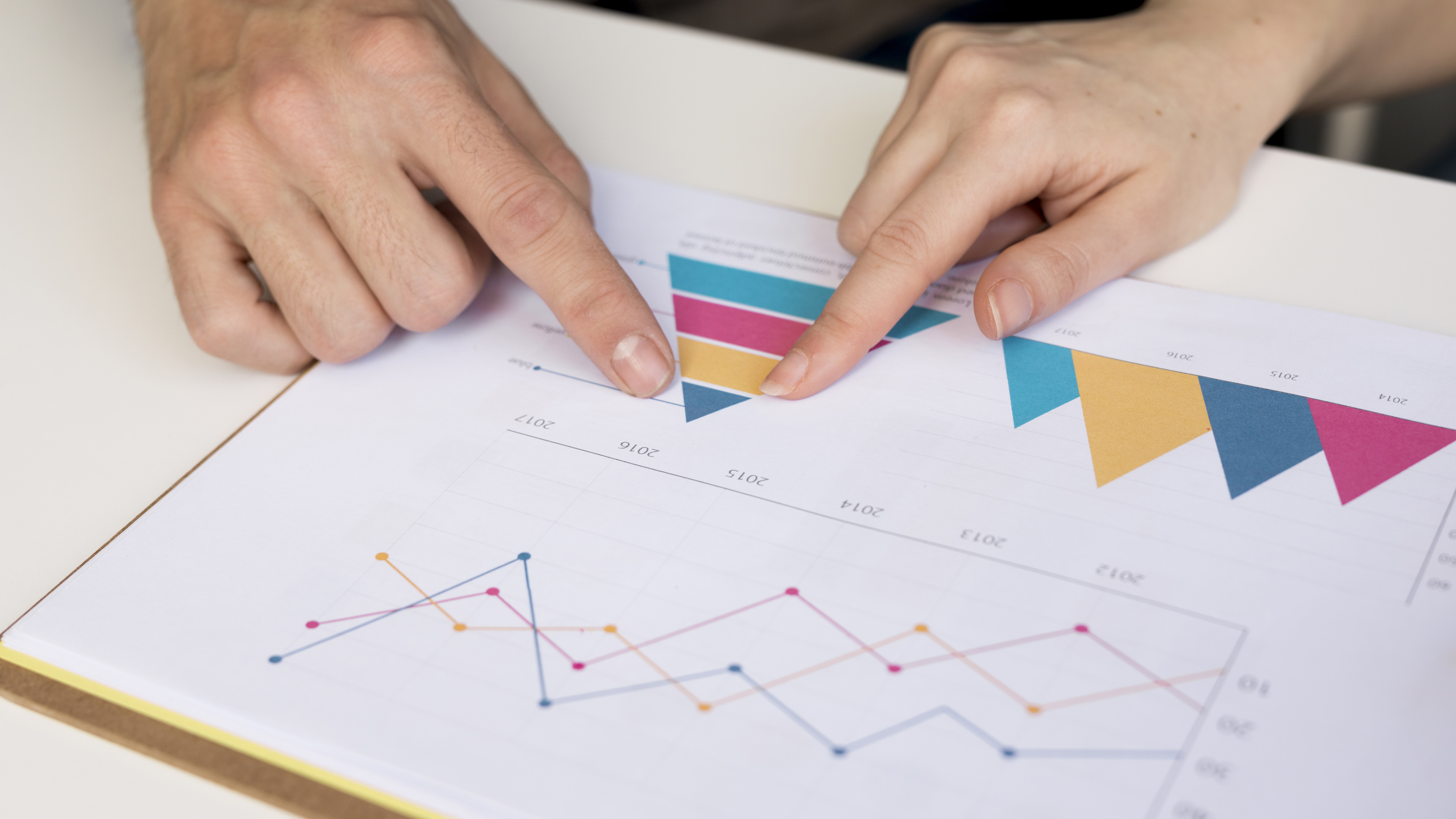 close-up-colleagues-analysing-business-chart