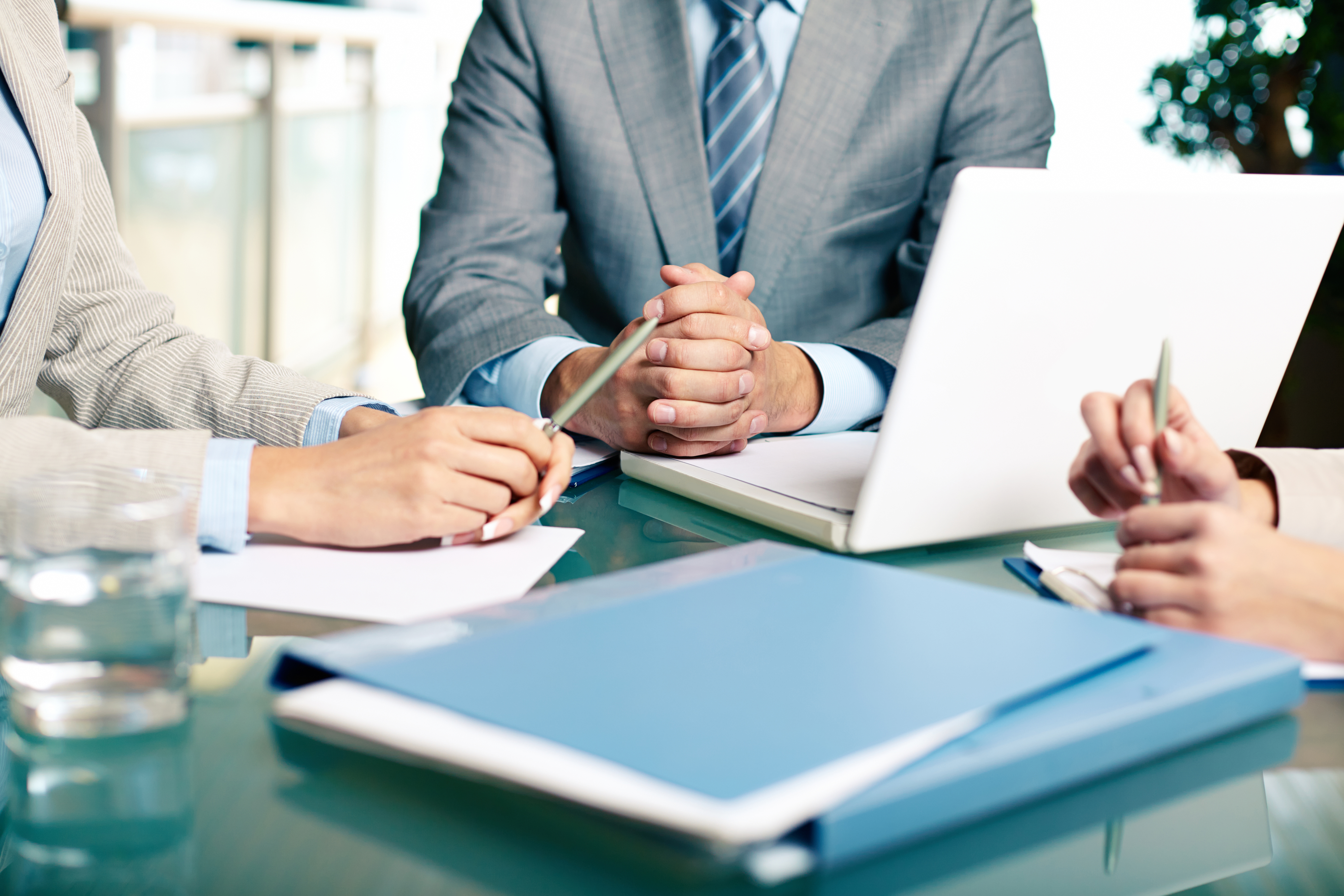 close-up-executives-sitting-table